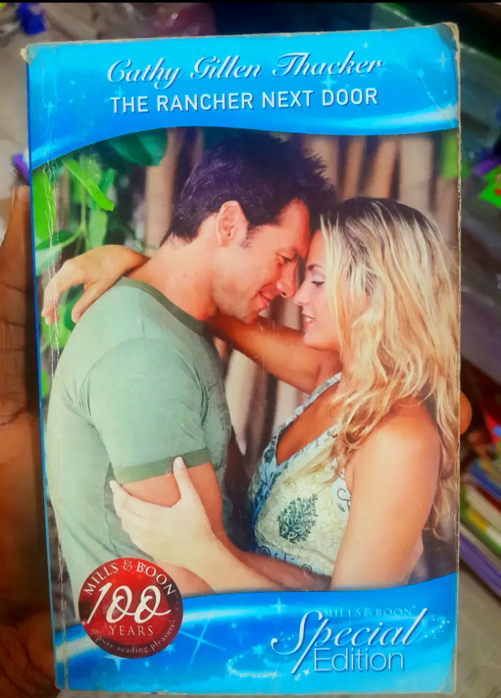 Cover of The rancher nextdoor 